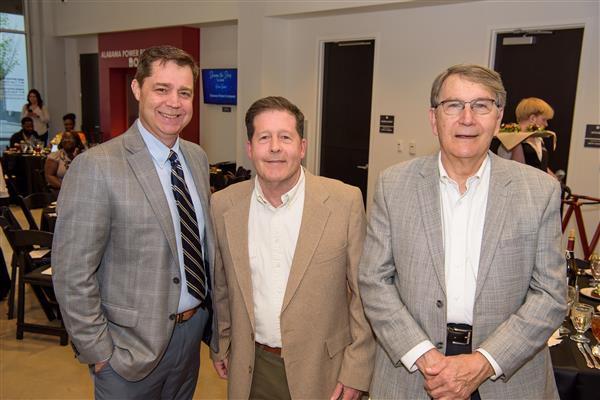 Dr. Dennis Gilliam, Tim Greene and Dr. Mike Kulovitz smile to the camera.